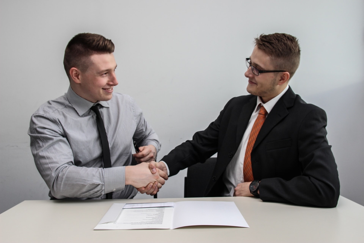 two men shaking hands